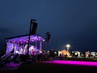 Summer Concert stage lit up purple.